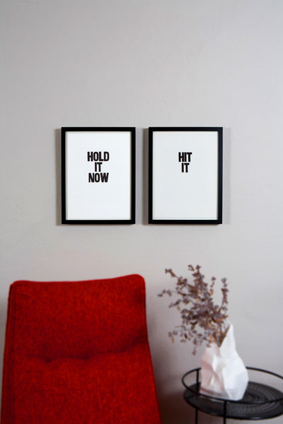 Framed letterpress poster pair with the sayings "Hold it now" and "Hit it"
